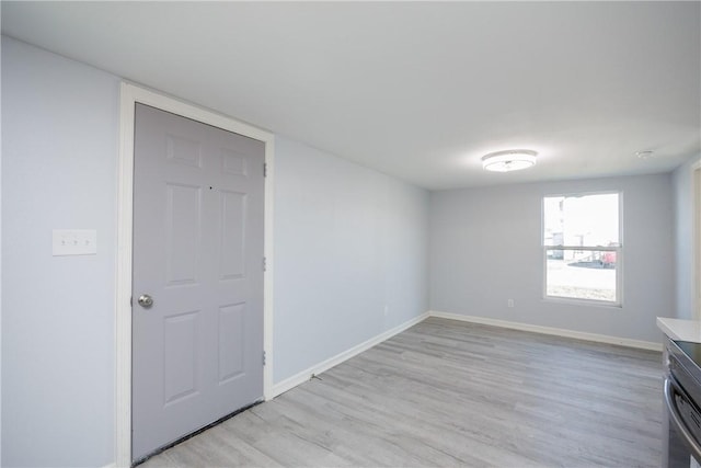 spare room with light wood-type flooring