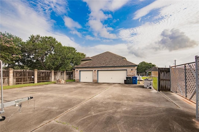 6714 Long Meadow Dr, Corpus Christi, TX 78413 - view of side of home featuring concrete driveway, brick siding, and roof with shingles