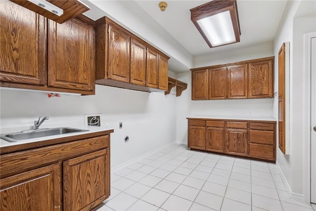 6714 Long Meadow Dr, Corpus Christi, TX 78413 - laundry room with cabinet space, light tile patterned flooring, washer hookup, electric dryer hookup, and gas dryer hookup
