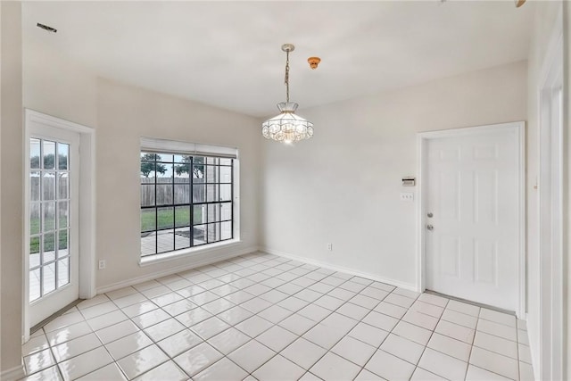 6714 Long Meadow Dr, Corpus Christi, TX 78413 - unfurnished room with light tile patterned floors and a chandelier