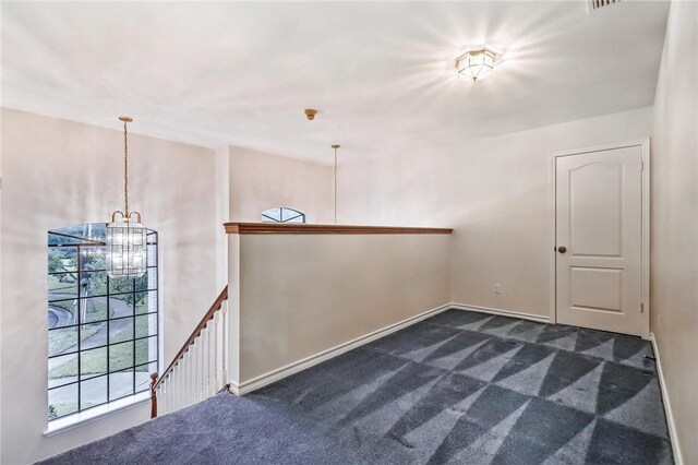 6714 Long Meadow Dr, Corpus Christi, TX 78413 - empty room featuring a chandelier and dark colored carpet
