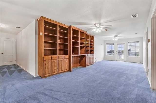 6714 Long Meadow Dr, Corpus Christi, TX 78413 - unfurnished living room featuring dark carpet and a ceiling fan
