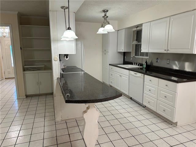 kitchen with dishwasher, white cabinetry, a breakfast bar area, and pendant lighting