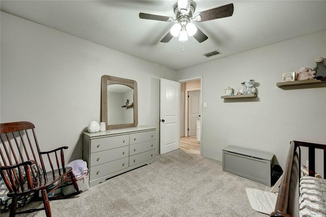 bedroom with ceiling fan and light carpet