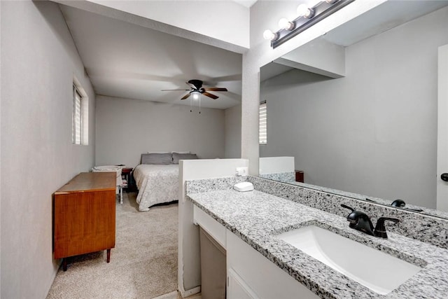 bathroom with ceiling fan and vanity