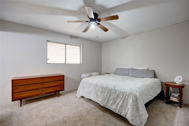 bedroom with light carpet and ceiling fan