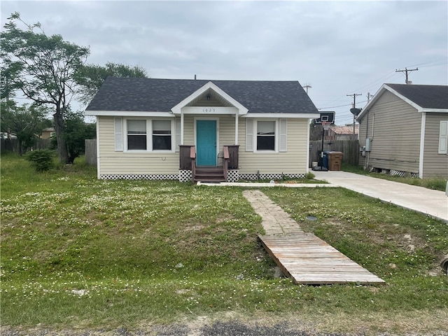 bungalow-style house featuring a front yard