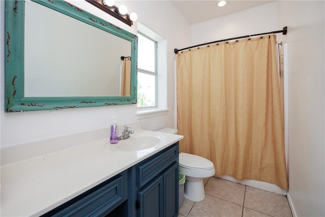 bathroom featuring vanity, curtained shower, tile patterned floors, and toilet