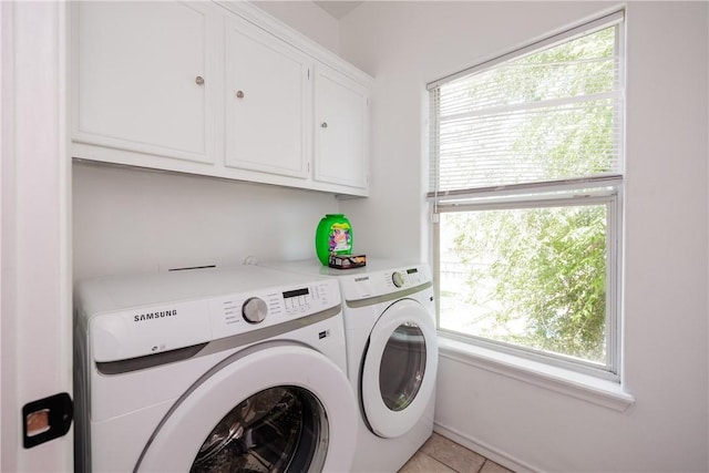 2626 Wool Dr, Corpus Christi, TX 78414 - laundry area with washer and dryer, cabinet space, and light tile patterned floors
