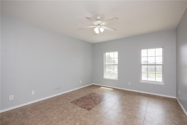 2626 Wool Dr, Corpus Christi, TX 78414 - unfurnished room featuring a ceiling fan, light tile patterned flooring, and baseboards