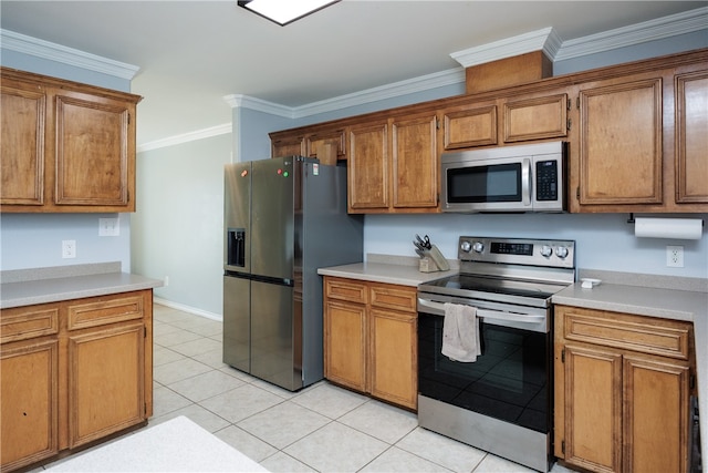 kitchen featuring stainless steel appliances, light tile patterned floors, and crown molding