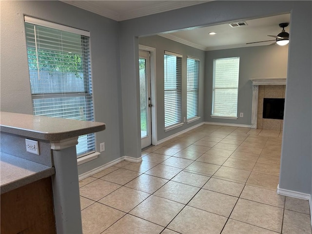 2626 Wool Dr, Corpus Christi, TX 78414 - entryway with baseboards, light tile patterned floors, crown molding, a fireplace, and ceiling fan