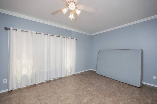 spare room with ceiling fan and ornamental molding