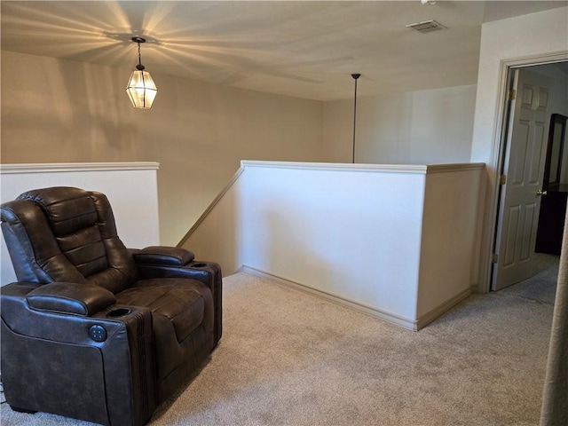 sitting room featuring carpet flooring