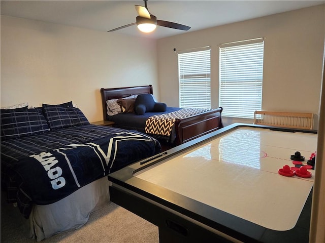 bedroom with ceiling fan, carpet, and radiator