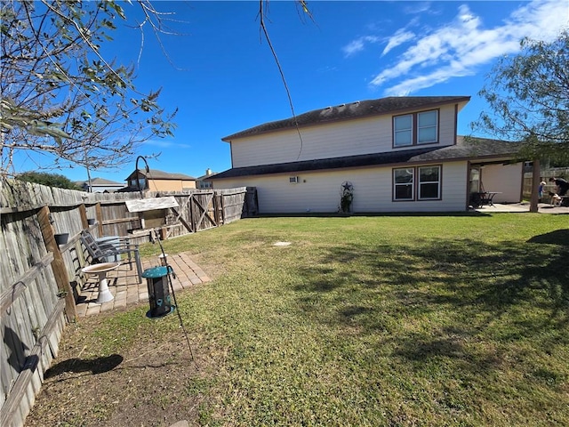 back of property featuring a lawn and a patio