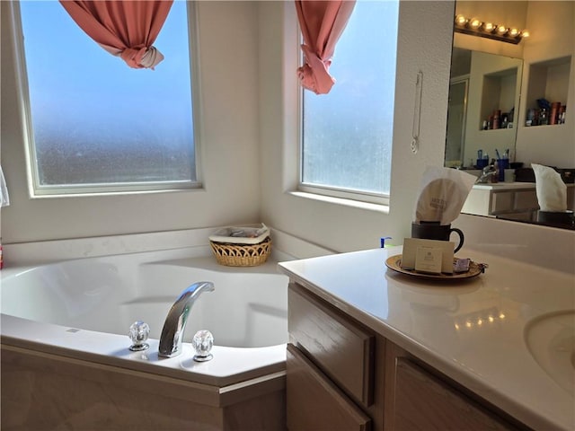 bathroom featuring a washtub and vanity