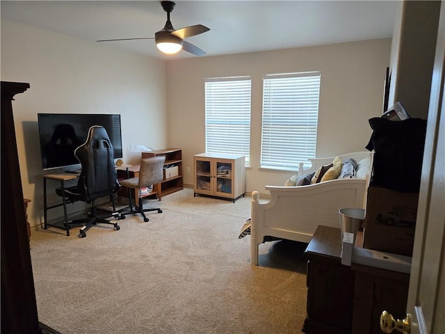 office featuring ceiling fan and light colored carpet