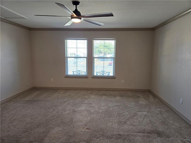 carpeted empty room featuring ceiling fan and crown molding