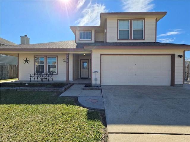 view of front property with a garage, a front lawn, and a porch