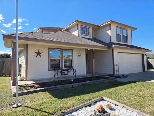 view of front of house featuring a front yard, a porch, and a garage