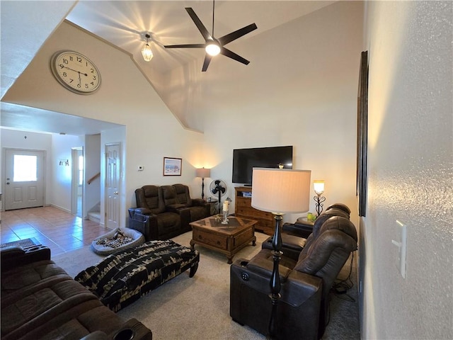 tiled living room featuring vaulted ceiling and ceiling fan