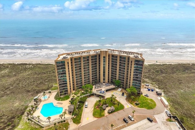 aerial view with a water view and a beach view