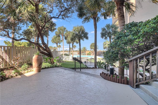 view of patio featuring a fenced in pool and a fenced backyard