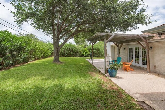 466 Coral, Corpus Christi, TX 78411 - view of grassy yard with french doors, a pergola, and a patio area