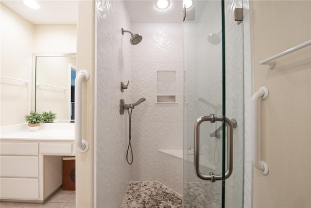 466 Coral, Corpus Christi, TX 78411 - bathroom featuring a shower stall, tile patterned flooring, and vanity