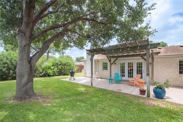 466 Coral, Corpus Christi, TX 78411 - back of house featuring a pergola, french doors, a lawn, a patio area, and brick siding