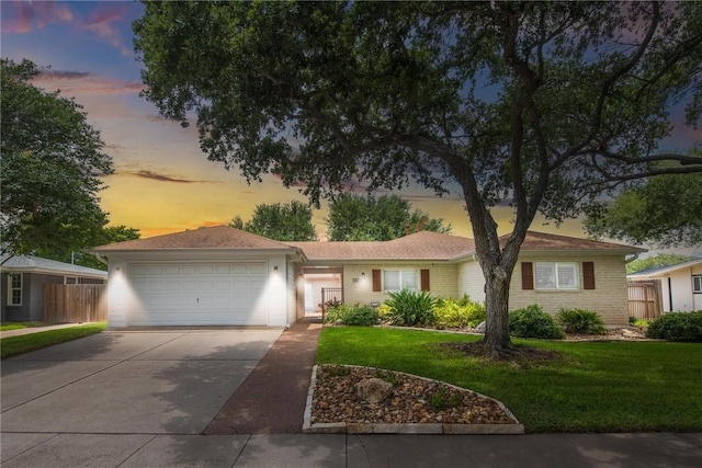 466 Coral, Corpus Christi, TX 78411 - ranch-style house with driveway, an attached garage, and brick siding