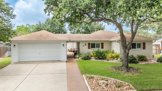 466 Coral, Corpus Christi, TX 78411 - ranch-style home featuring concrete driveway, an attached garage, and brick siding