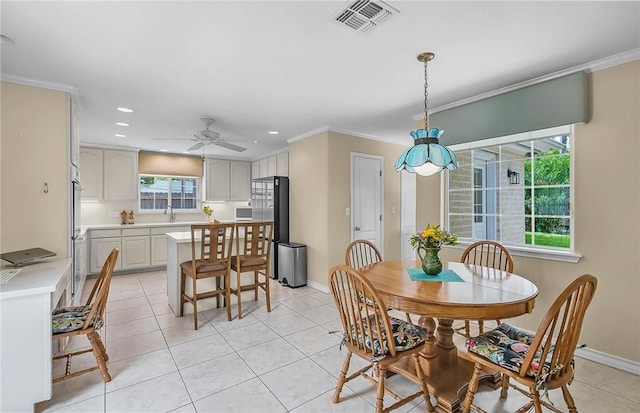 466 Coral, Corpus Christi, TX 78411 - dining room with light tile patterned floors, ornamental molding, recessed lighting, and ceiling fan