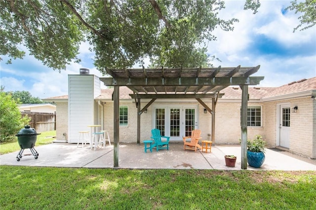 466 Coral, Corpus Christi, TX 78411 - back of property featuring a pergola, a patio area, brick siding, french doors, and a chimney
