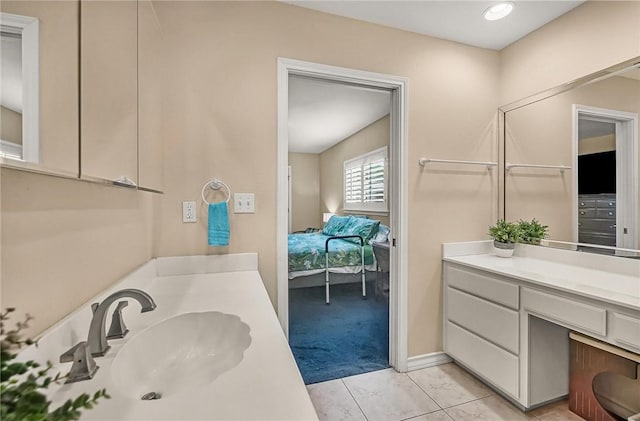 466 Coral, Corpus Christi, TX 78411 - ensuite bathroom featuring vanity and tile patterned flooring