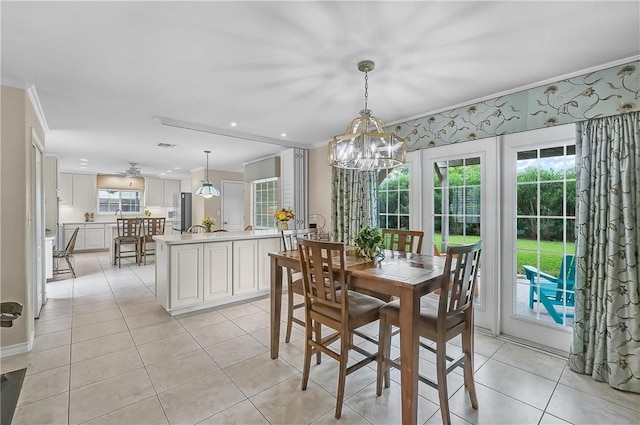 466 Coral, Corpus Christi, TX 78411 - dining space featuring ornamental molding, a chandelier, and light tile patterned floors