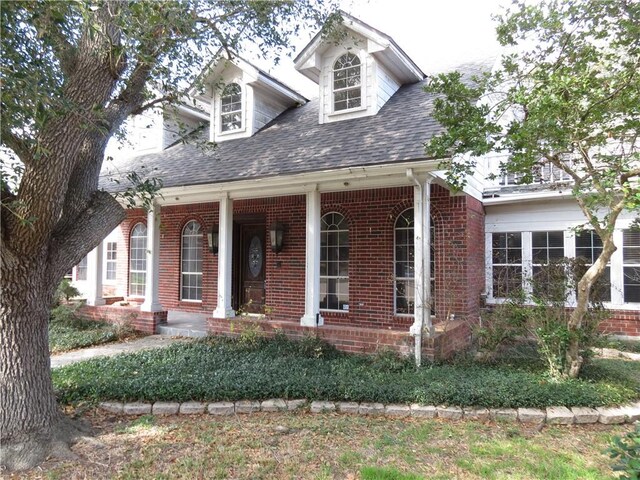 view of front of property with a balcony and a garage