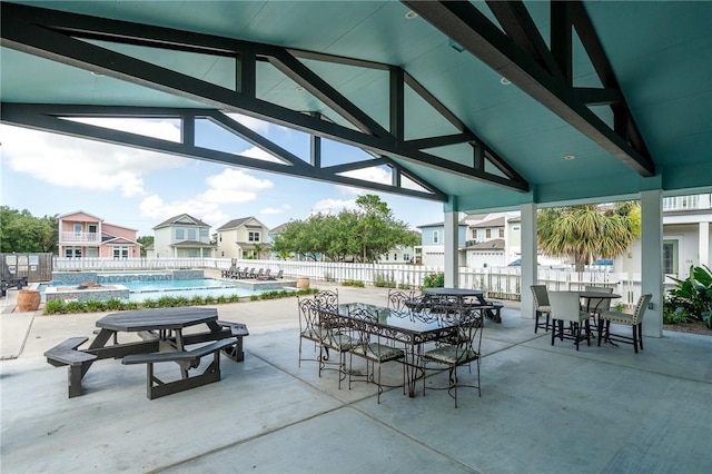 122 Lavaca Cir, Rockport, TX 78382 - view of patio with a residential view, a fenced in pool, outdoor dining space, and fence