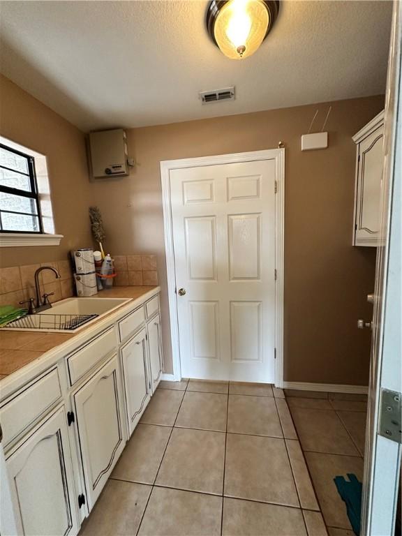 bathroom featuring tile patterned floors and vanity