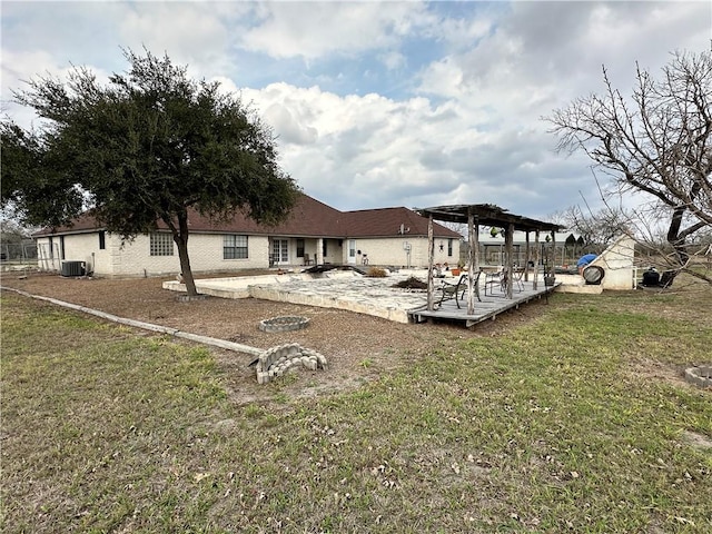 view of yard featuring a wooden deck, a patio area, and a pergola