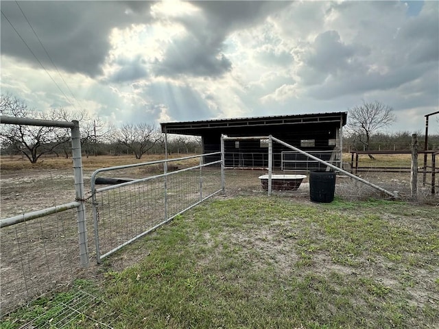 view of outdoor structure with a rural view