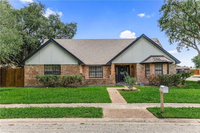 3658 Castle River Dr, Corpus Christi, TX 78410 - tudor home with brick siding and a shingled roof