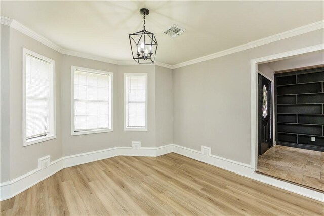 3658 Castle River Dr, Corpus Christi, TX 78410 - empty room with a chandelier, light wood finished floors, and crown molding