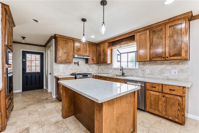 3658 Castle River Dr, Corpus Christi, TX 78410 - kitchen featuring appliances with stainless steel finishes, tasteful backsplash, light countertops, decorative light fixtures, and under cabinet range hood