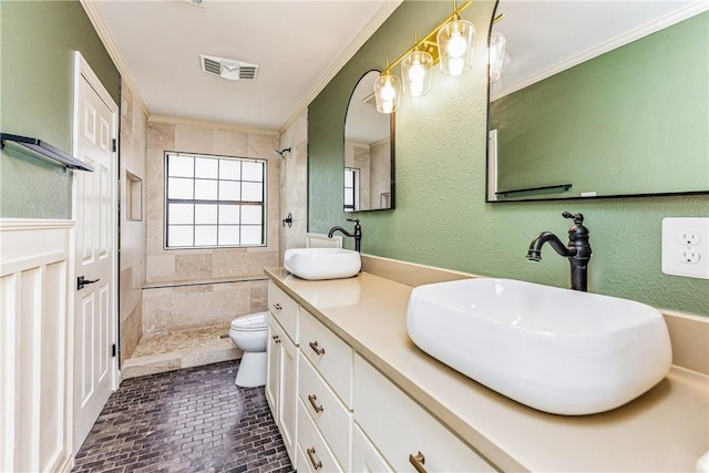 3658 Castle River Dr, Corpus Christi, TX 78410 - full bath featuring a tile shower, ornamental molding, double vanity, and brick patterned flooring