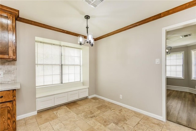3658 Castle River Dr, Corpus Christi, TX 78410 - unfurnished dining area with a chandelier and ornamental molding