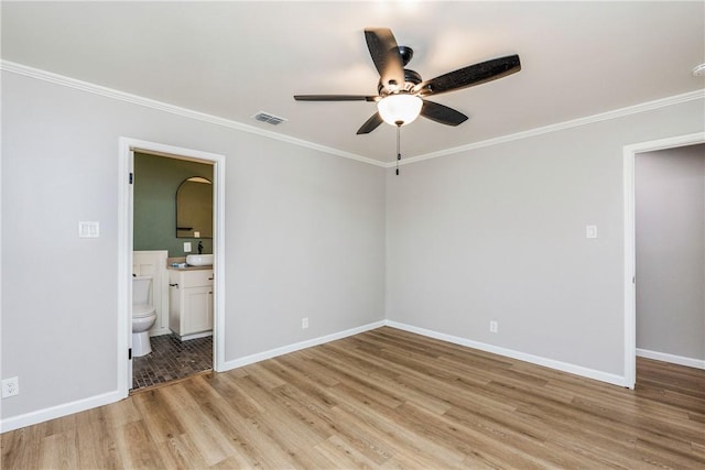 3658 Castle River Dr, Corpus Christi, TX 78410 - unfurnished bedroom featuring light wood finished floors, crown molding, ensuite bath, and ceiling fan