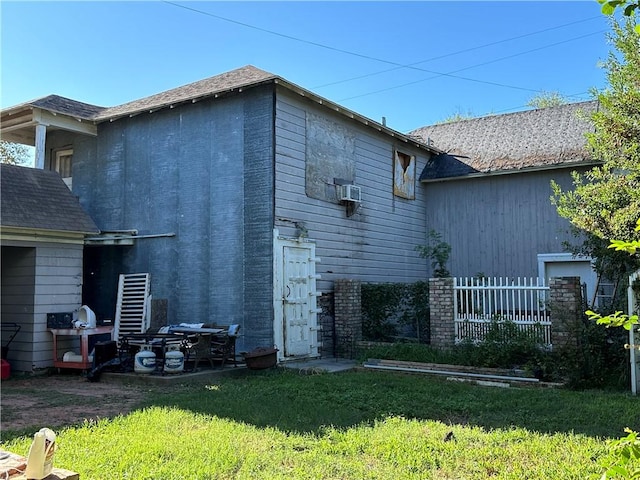 view of side of home featuring a lawn