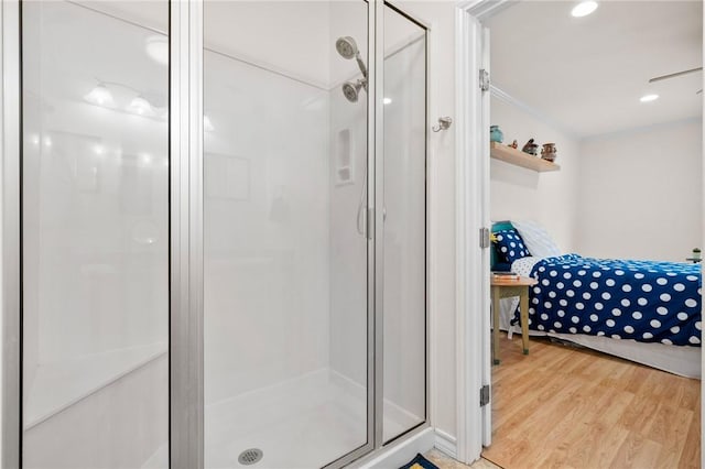 bathroom with hardwood / wood-style floors and walk in shower